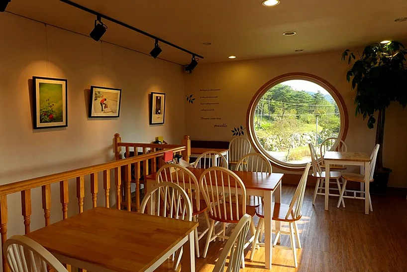 dreaming camera cafe is shaped like a vintage rolleiflex designboom 08